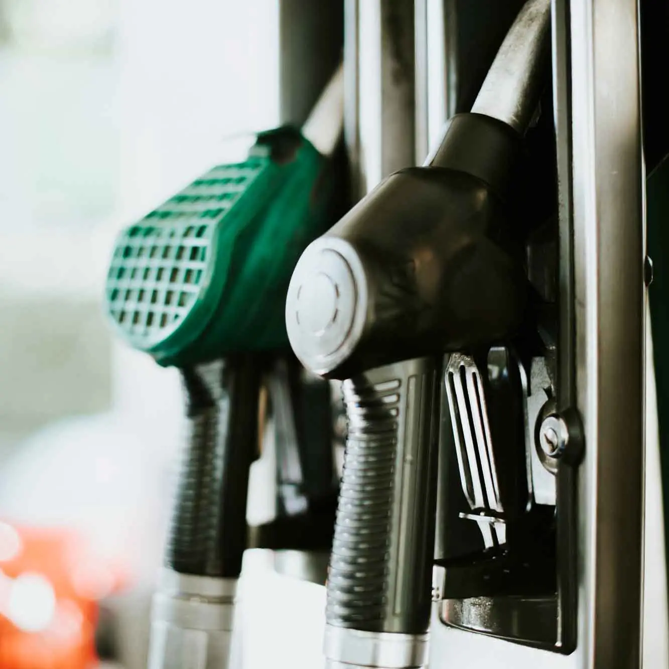 Fuel dispenser nozzles at a station